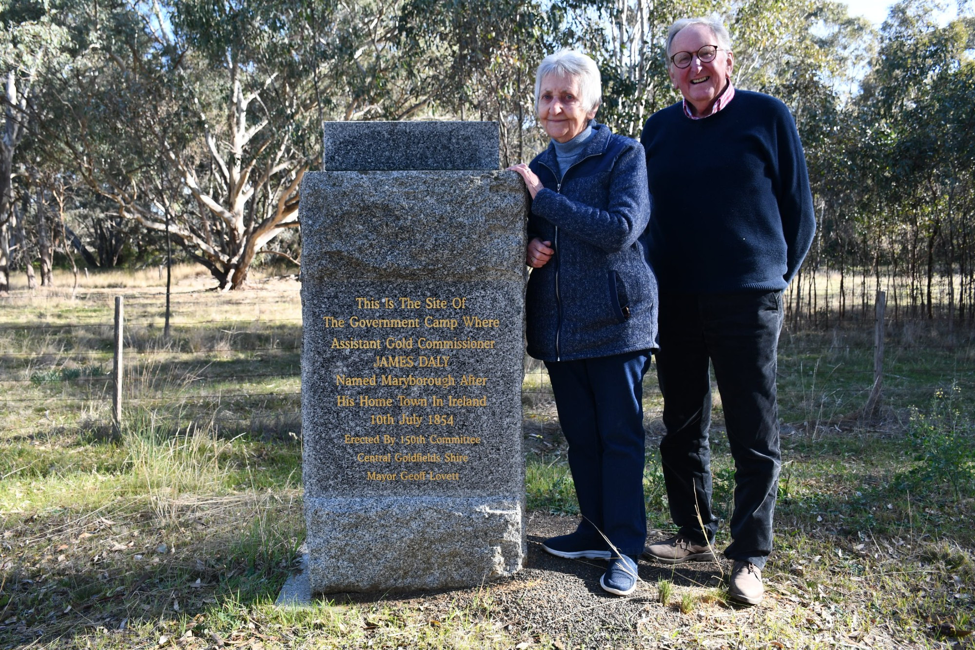 Maryborough Midlands Historical Society members Margaret Harrison and Geoff Lovett at the James Daly cairn in Simson.