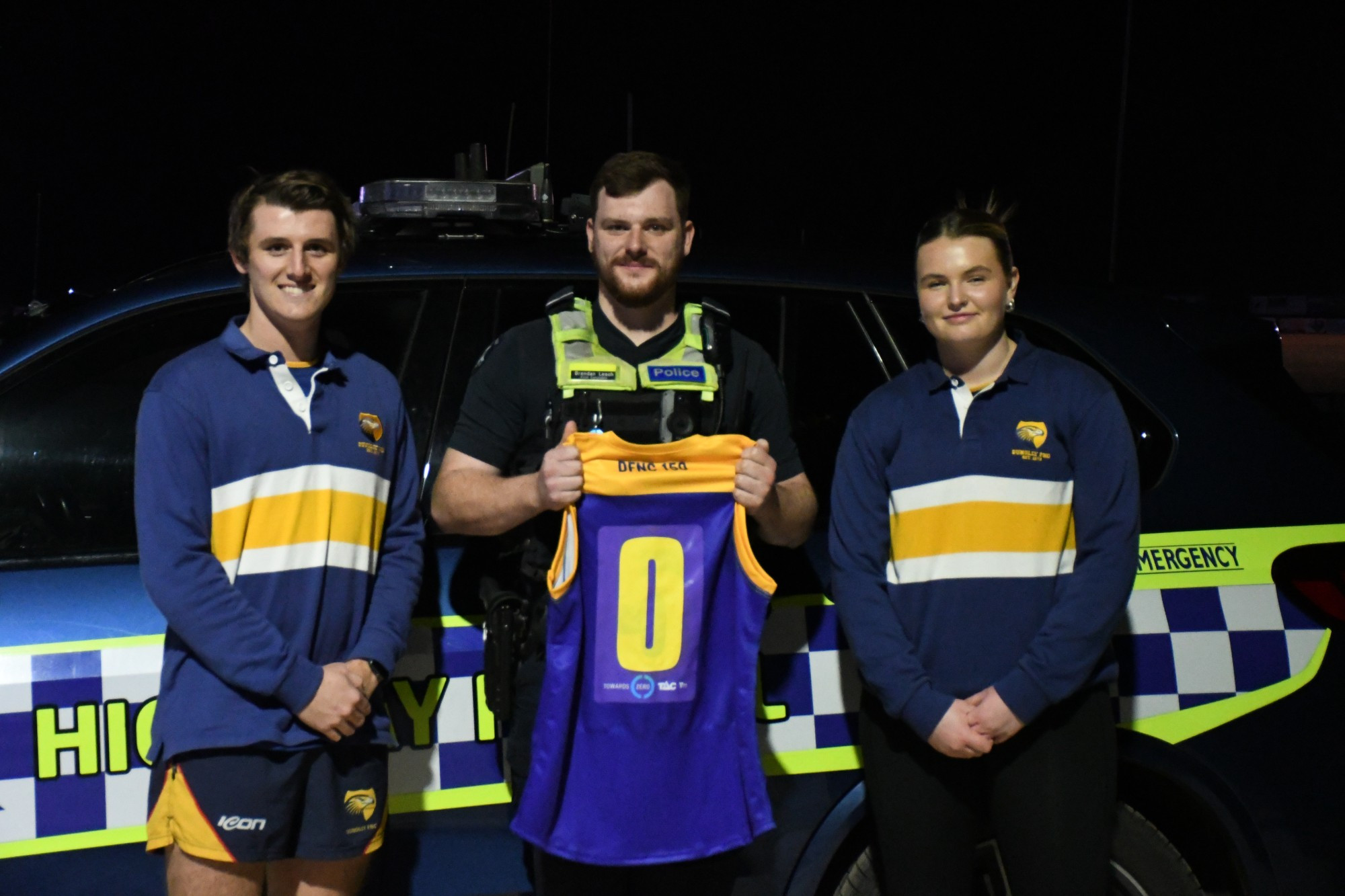 All clubs will participate in Road Safety Round, including Dunolly, with football captain Xavier Ryan and Zoe Aldridge flanking First Constable Brendan Leach.