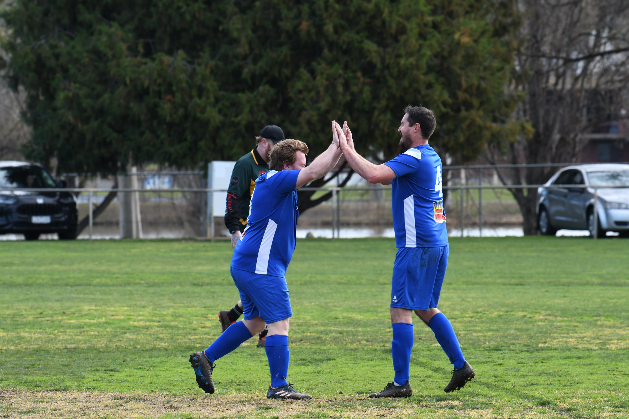 Johno Melton celebrates his goal with playing-coach Jack Schafer.