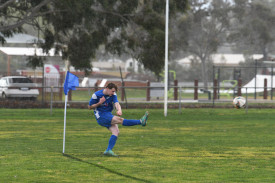 Riley Gardam looks to whip in a corner in the wet weather.