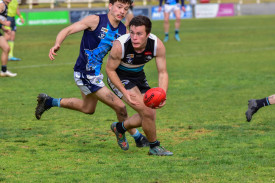 Josh Britten looks to fire off a handball.