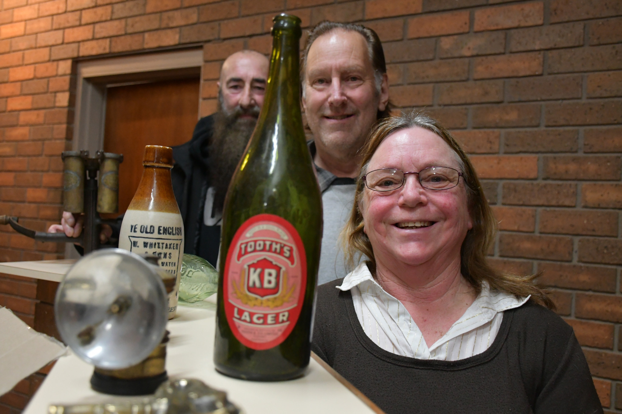 Maryborough Antique Bottle Club members Maxine and Steve Greenwood and Ned Abel expect the Maryborough Antique Bottle Show to be a glass-act.