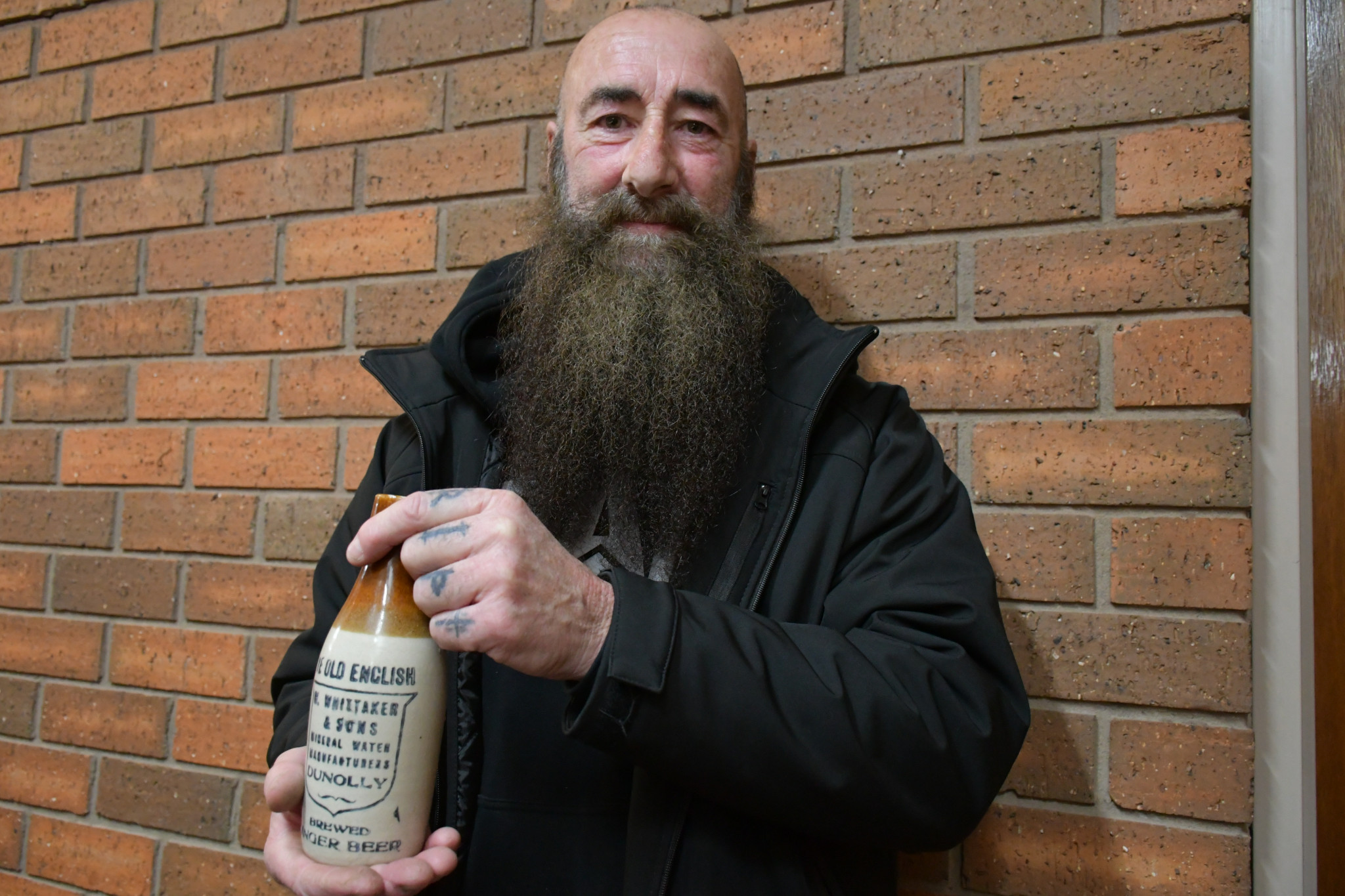 Maryborough Antique Bottle Club member Ned Abel with a local antique bottle.