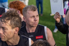 A visibly emotional Coby Perry as he coaches the final three-quarter-time huddle of the season.