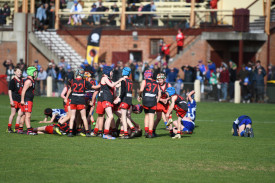 Carisbrook under 11.5 footballers swarm the field as they take the flag over the previously undefeated Newstead, claiming the first football premiership of the morning.