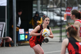 Maldon’s Jess Davies looks to keep the ball inside the Dons’ goal third in the 17 and under grand final.