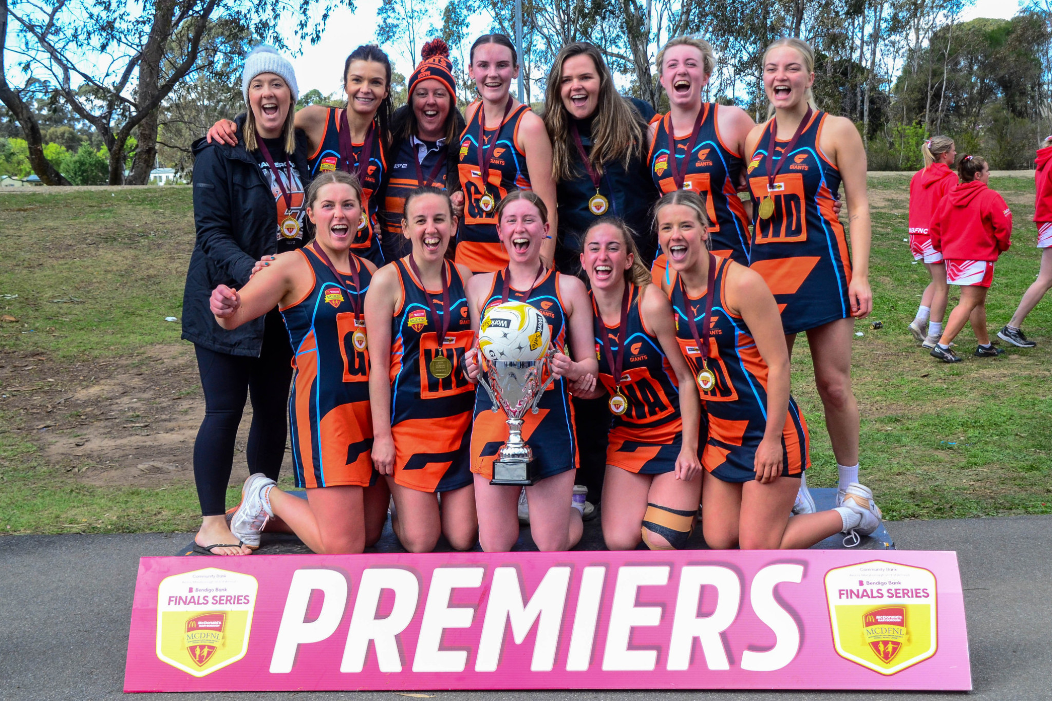 A jubilant Maryborough Giants team celebrates their first ever premiership, taking out the B grade decider.