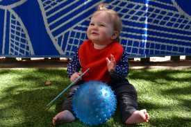 Kinsley having a ball with the blue-themed activities.