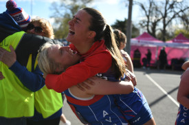 Caitlin Drummond and Ellie Meagher celebrate Avoca’s A grade premiership.