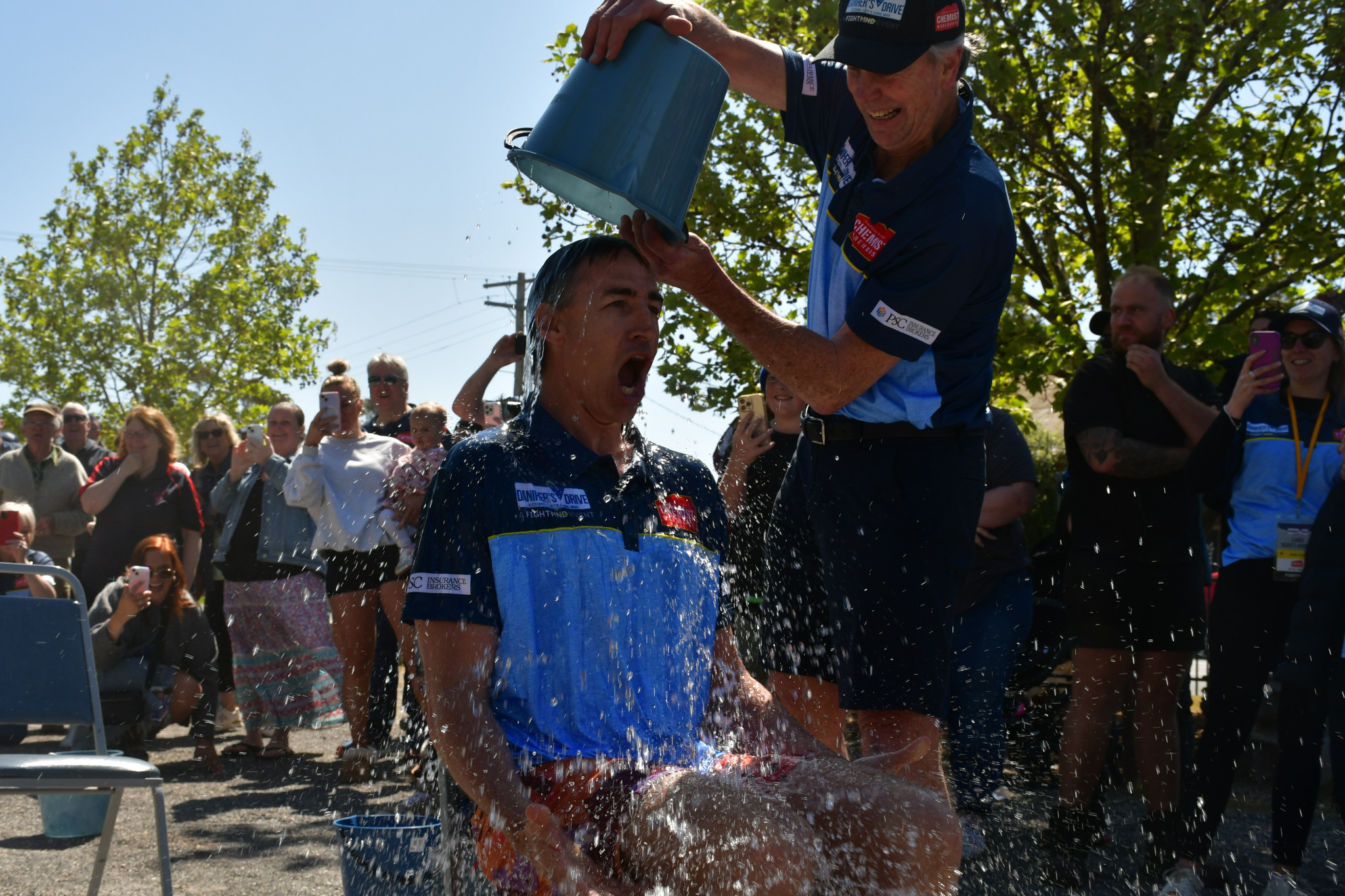 Terry Daniher giving Clint Bizzell an icy surprise.