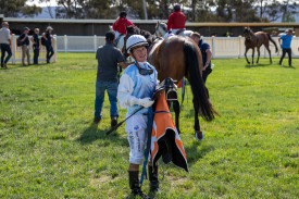 Cup winning jockey Kate Walters dismounts after the race.