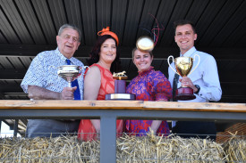 Maryborough Harness Racing Club president Colin Phillis, Kendall McFadyen, Beck Maddocks and general manager Jackson Barby with the cups on display for Sunday’s key events. Photo: Prealene Khera.