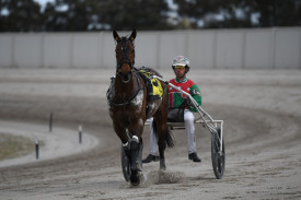 Just Believe, piloted by Greg Sugars, returns to the front straight to accept the Maryborough Gold Trotters Cup after a sensational run.