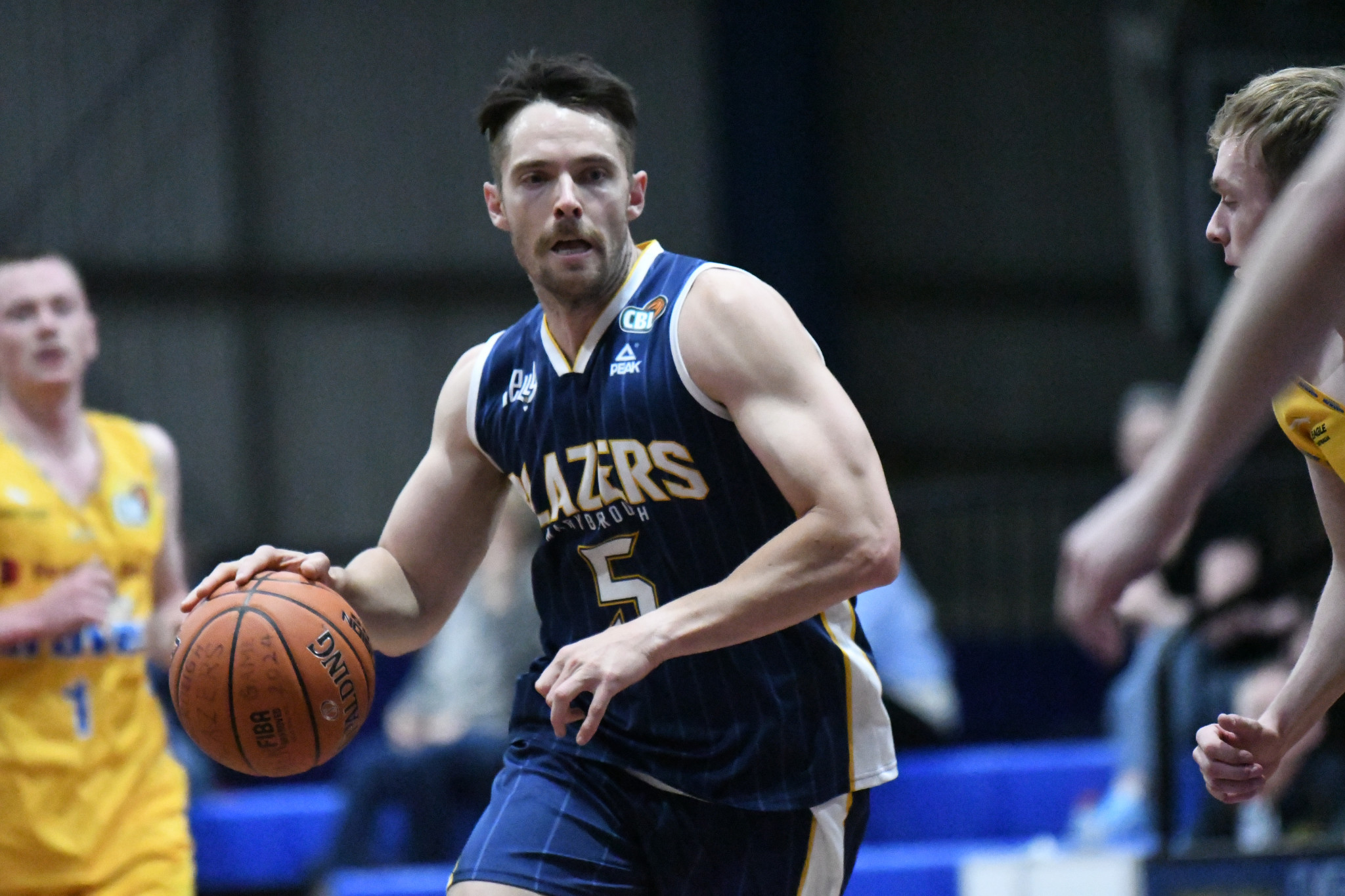 Brady Neill looks to drive to the rim.