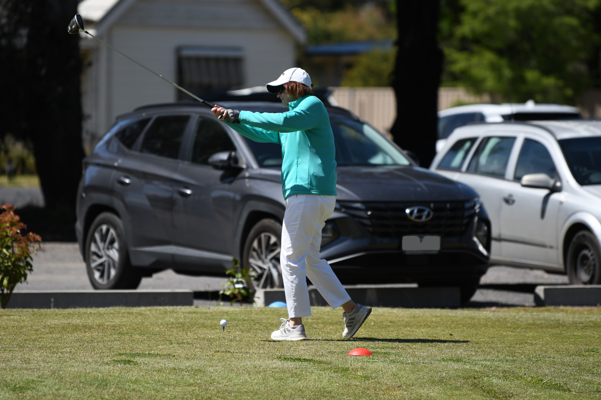 Wendy Carmody practices her swing ahead of her first shot of the tournament.