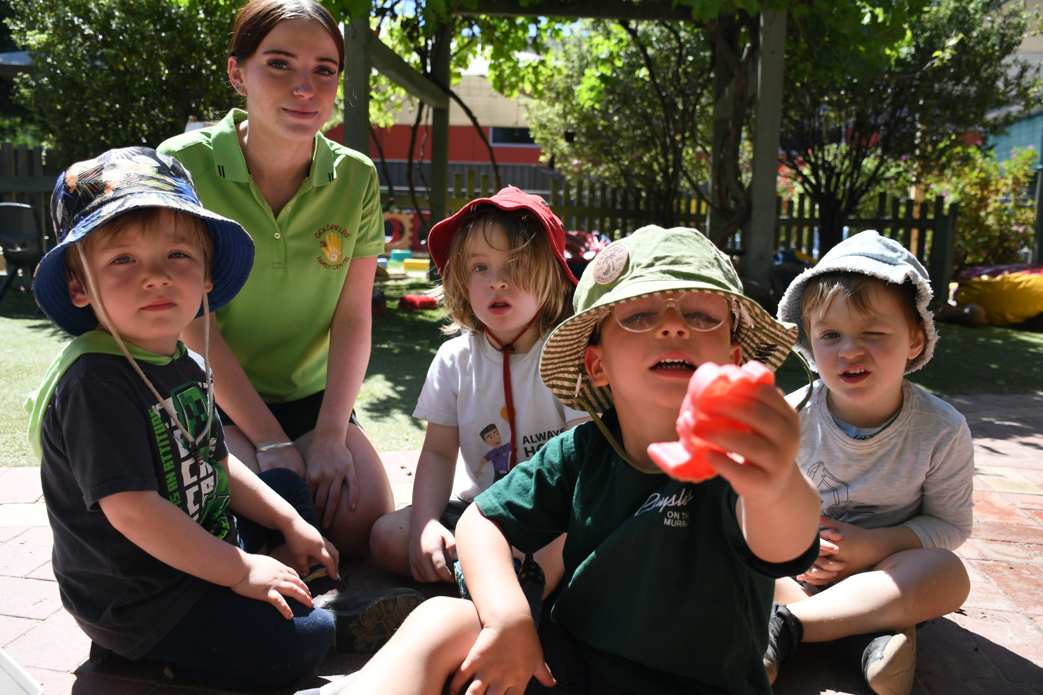 Early childhood educator trainee Hayley Brame has already made strong relationships with students Fox, Silas, Maverick and Hunter.