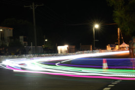 The traditional night-time shenanigans going into turn three, with plenty of trikes lighting up the circuit.