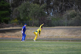 Joshua Cooper gets acrobatic in the hunt for wickets for Maryborough.