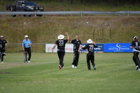 Clunes players celebrate Jax Coon’s first wicket.