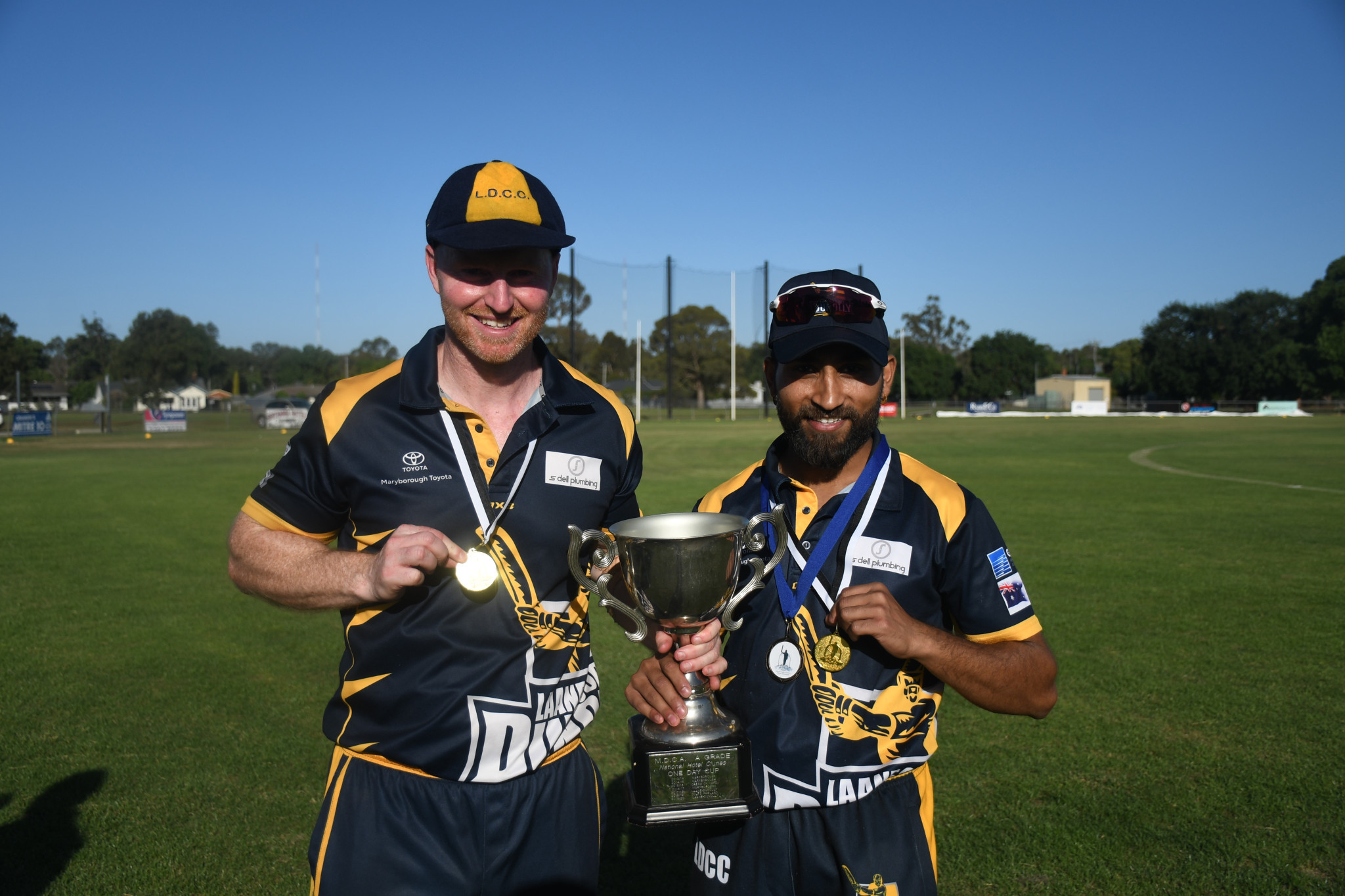 Laane captain Matt Smith with best-on-ground Kamaljot Romana.