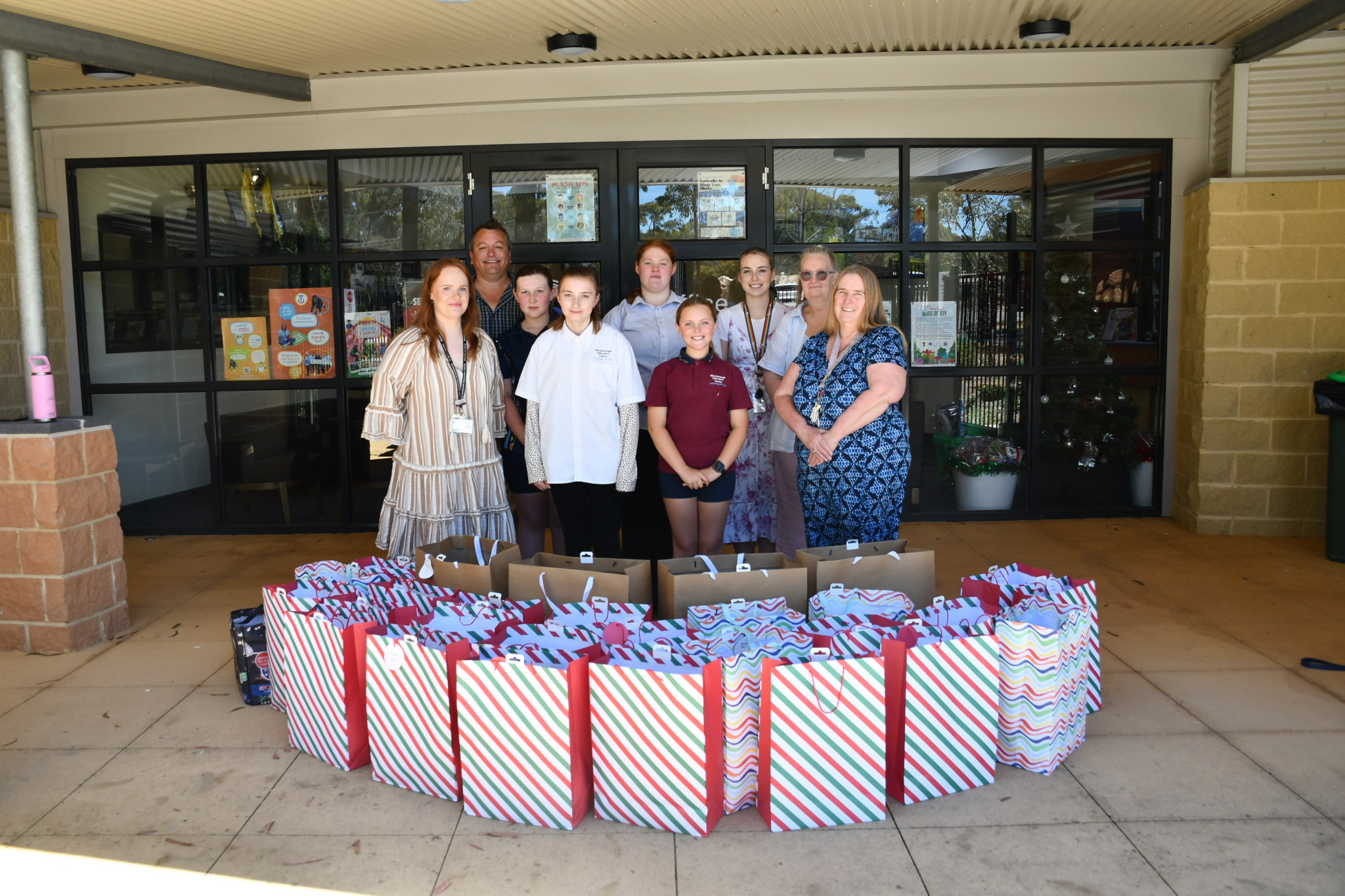 Representatives from MEC and MCH together with donations for Bags of Joy.