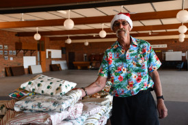 Graeme “Chook” Johnson with some of the gifts donated for the event.