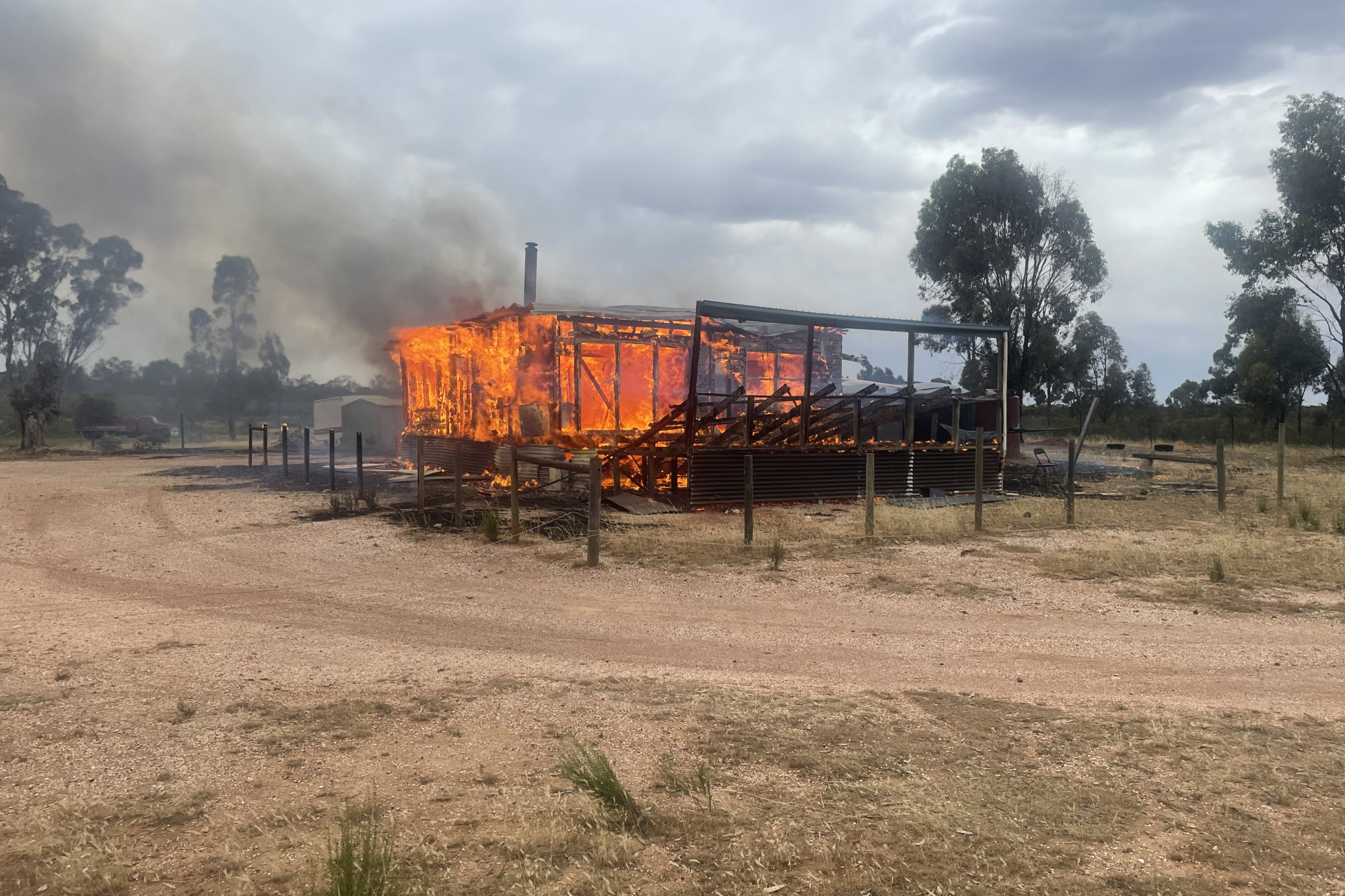 Firefighters arrived to find the structure fully engulfed.