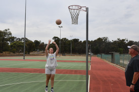 Charlotte Tierney practicing her goal shooting at the Maryborough Netball Complex.