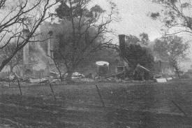 Smoke is still seen rising from the remains of this home. Twelve homes were lost in Avoca despite the quick actions of local volunteers.