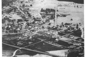Talbot was hit early after the wind change. This aerial picture shows the burned ground surrounding the town. The bypass road on the main Ballarat-Maryborough road is in the foreground.