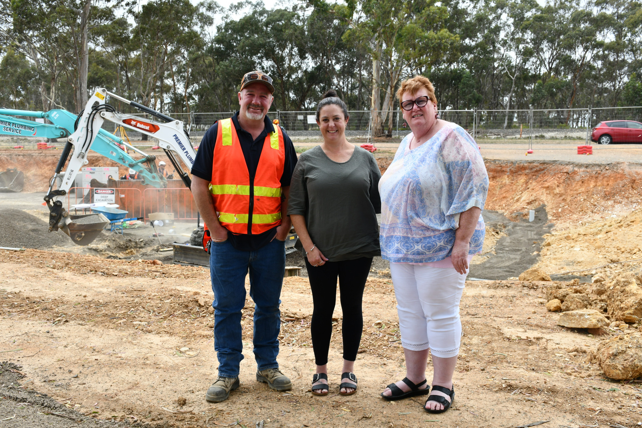 Stacey Perry (middle) and Tracey Saunders pictured with one of the contractors who will continue on the new build for the remainder of 2025.