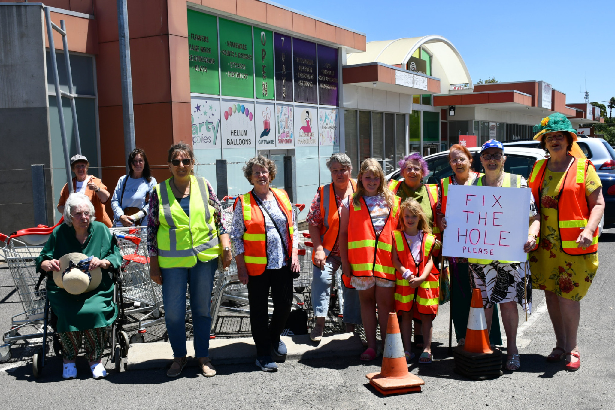 The protesters gathered for over an hour chanting at other shoppers and those driving past