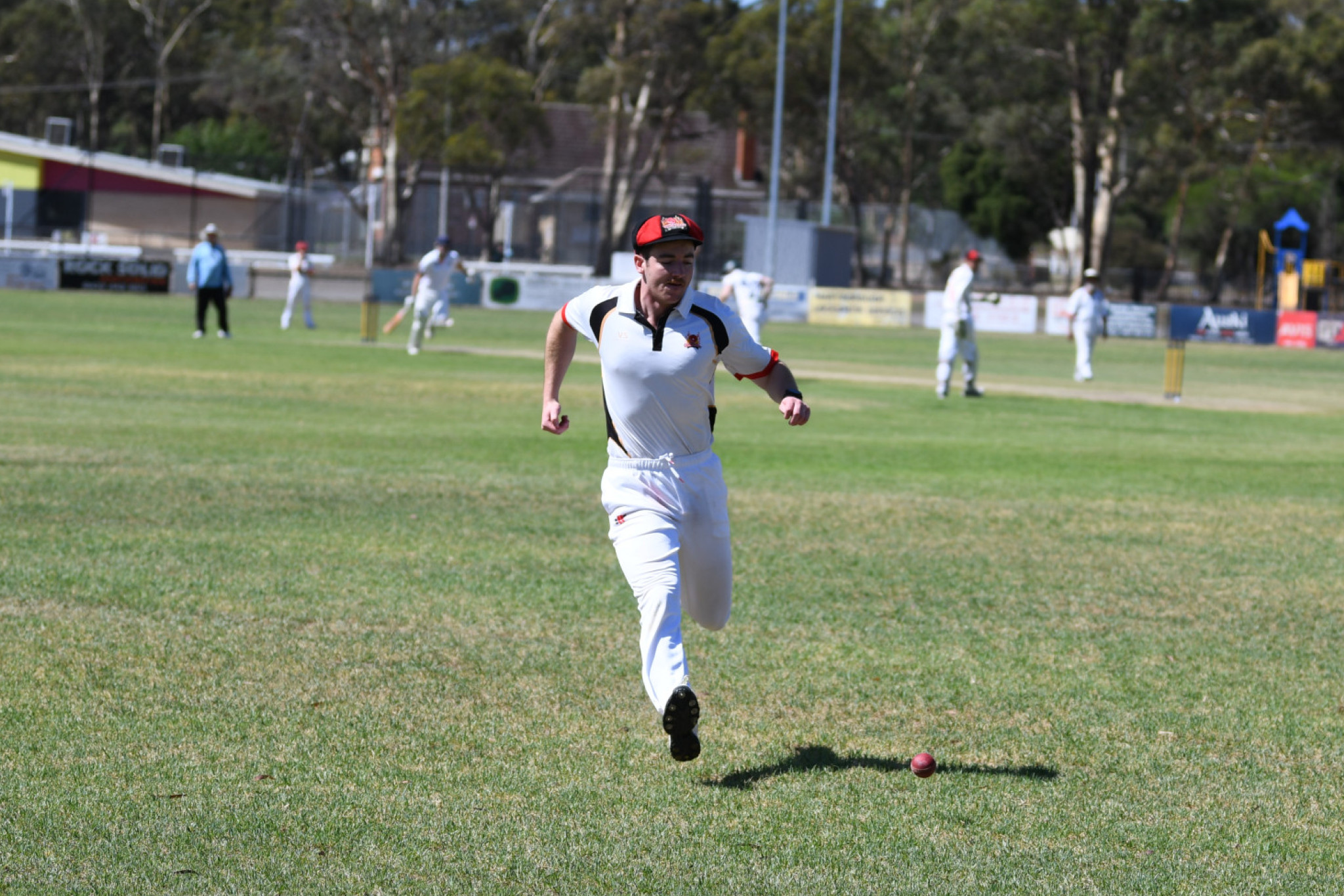 Jordan Hooper chasing a ball down against Laanecoorie Dunolly.