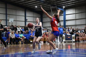Bridget Allan goes in for a layup for the U18 Lady Blazers.