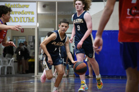 Billy Skinner dribbling the ball for the U18 Blazers.