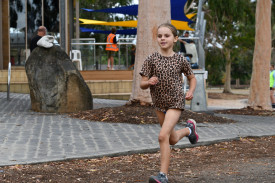 Regan completing the transition from the swim to the bike ride.