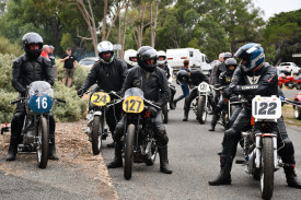 Motorcycle enthusiasts eagerly wait for their turn at the straight.