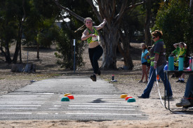 Naomi Henderson participates in the triple jump in her last little athletics event.