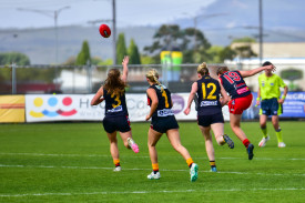 The Redback’s Olivia Butler sends one out of the centre.