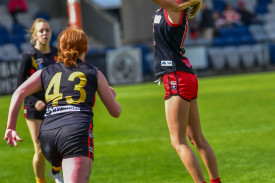 Emme Johnson flies high for a mark for Carisbrook.