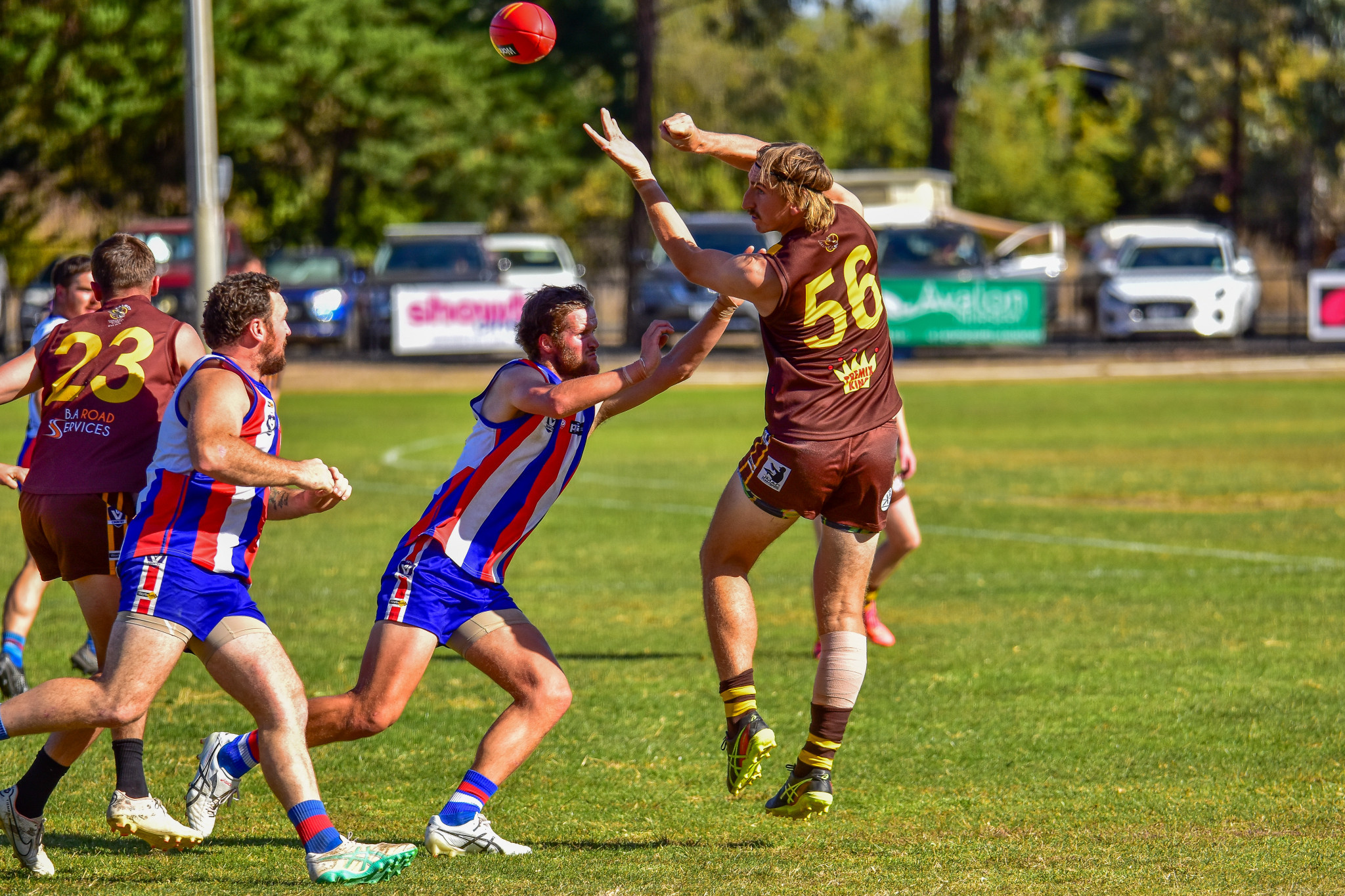 Aaron Collicoat gets a handball away for Talbot under heavy Avoca pressure.