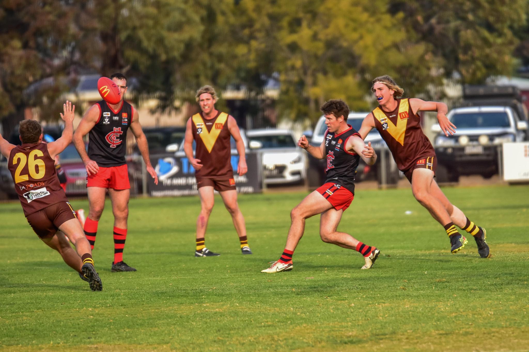 Nicholas Wright sends the ball forward for Carisbrook.