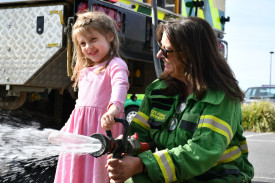Bystanders beware when Edie Robertson gets a hold of Susan Gray’s Forest Fire Management hose.
