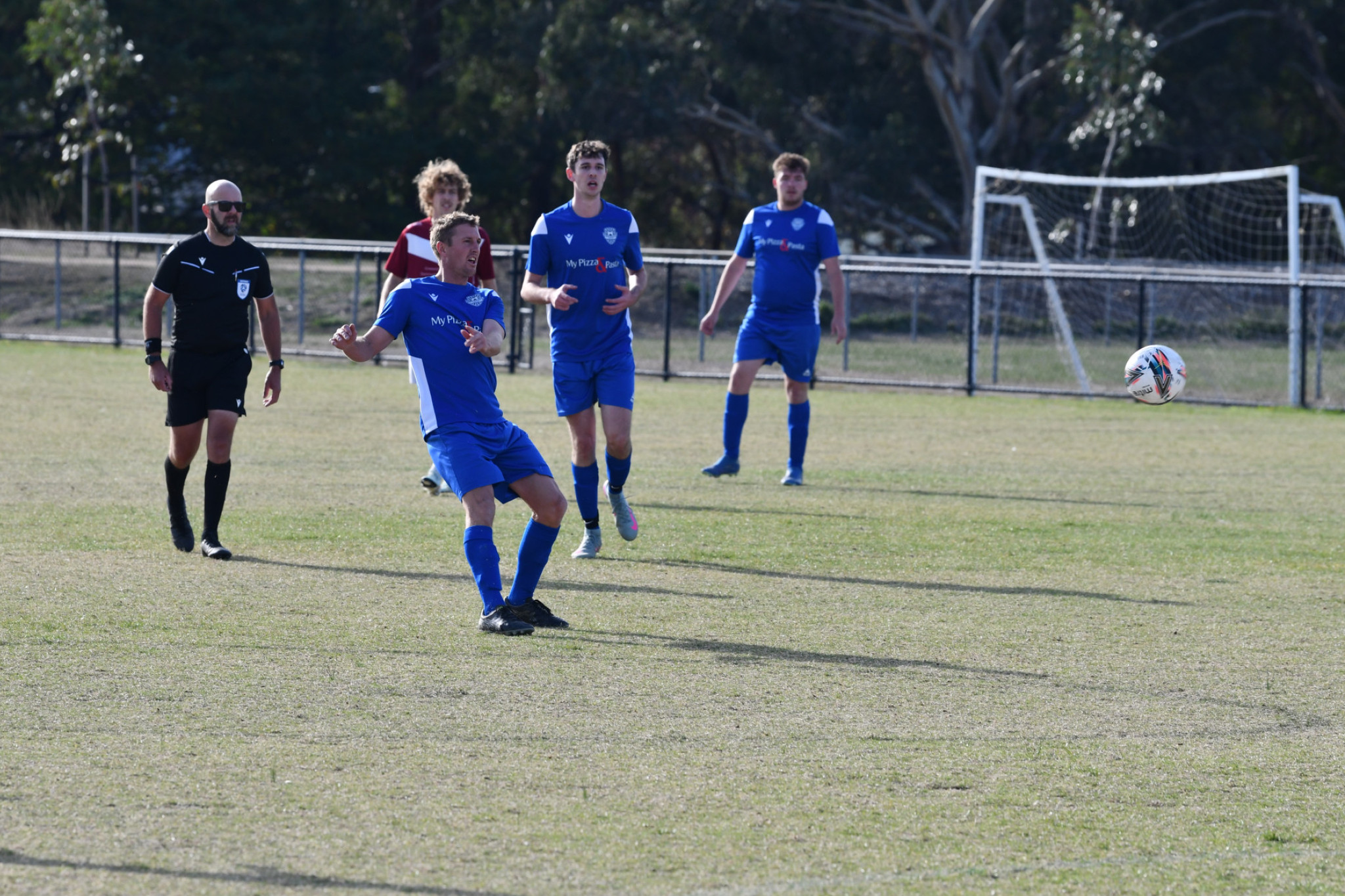 Luke Bucknall playing an incisive through ball in search of an opening for the blue and whites.