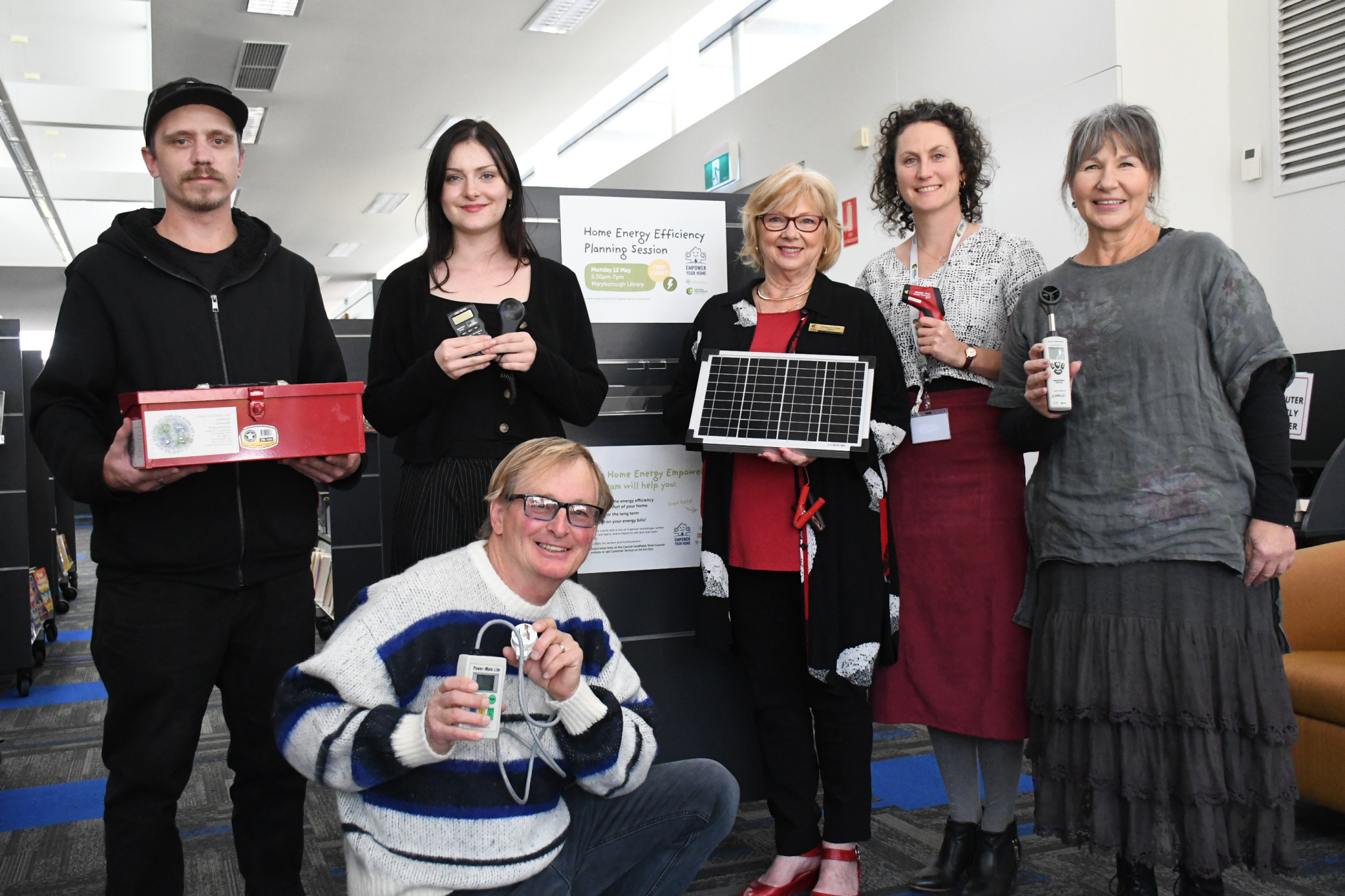 John Howden, Annabel Knowles, Tony Macer, Grace La Vella, Julia Walsh, and Michelle Baker with different gadgets locals will learn how to use at the upcoming home energy empowerment event.