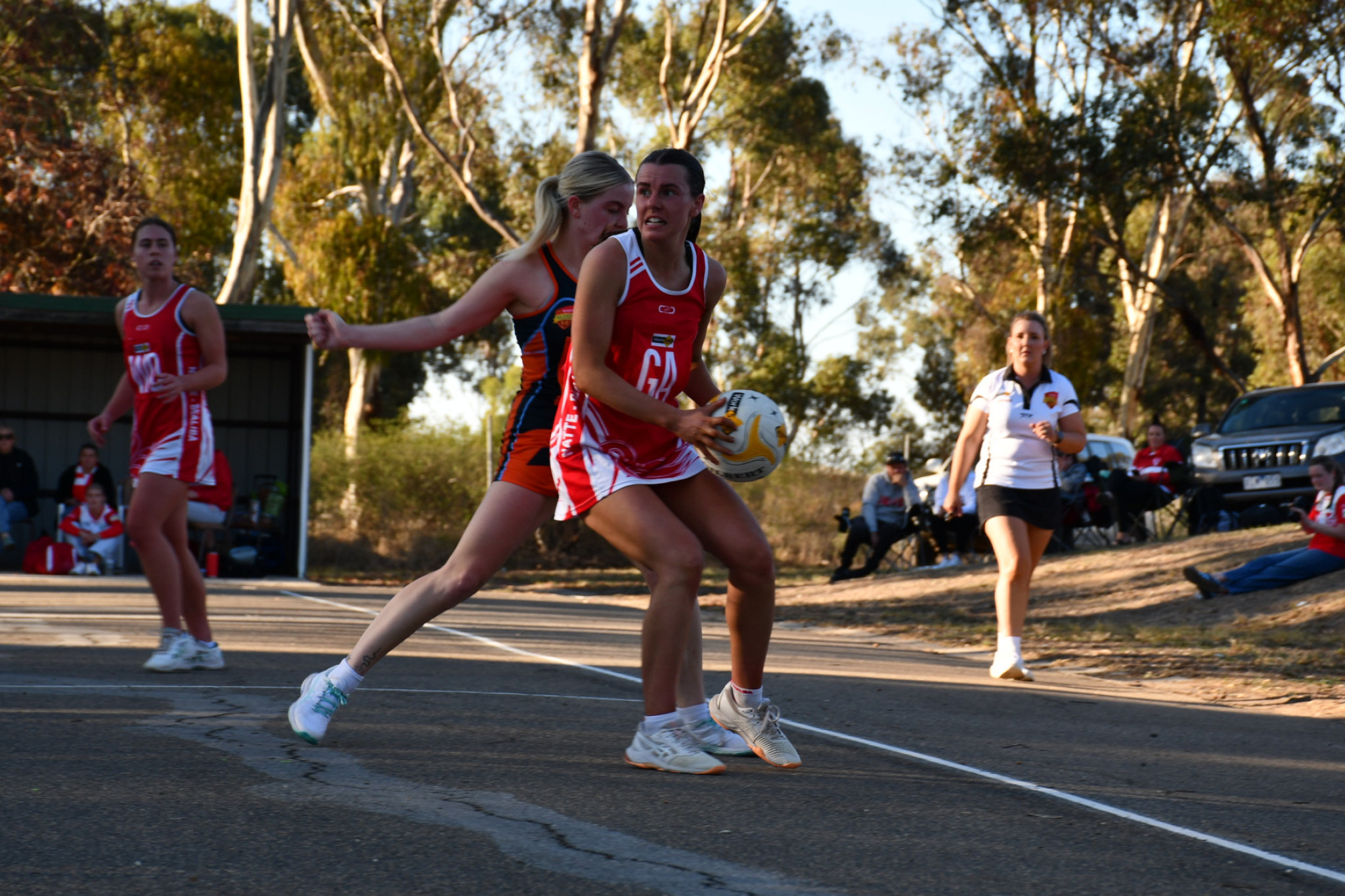 Shannae Mills looks to move the ball forward for the Swans.
