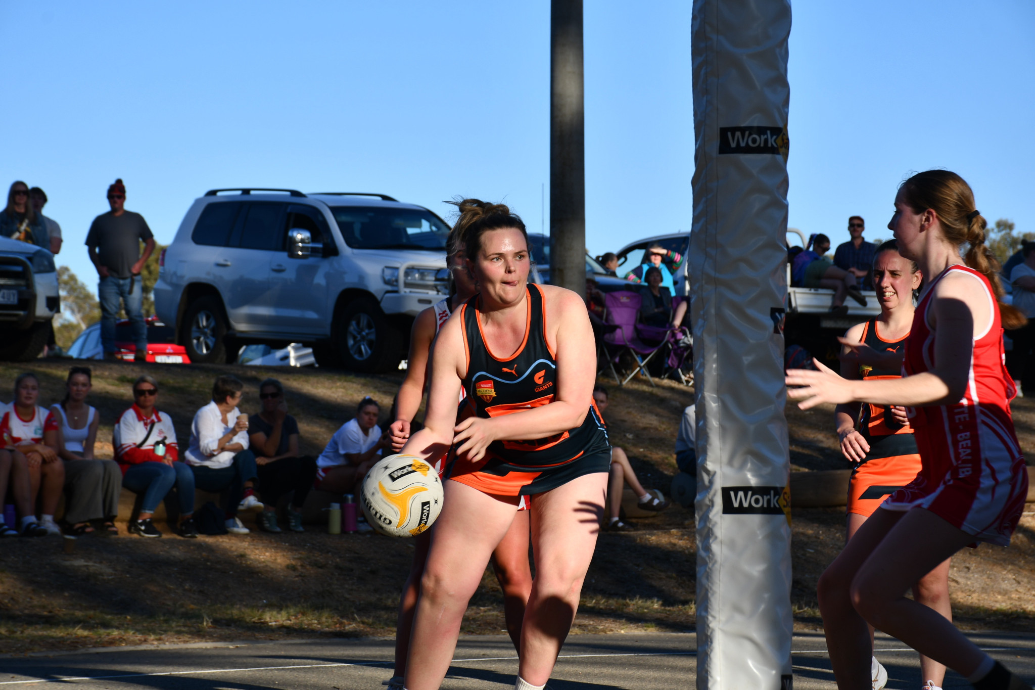 The Giants’ Annalyse Carroll looking to sneak a ball to shooting partner Lacey Broad.