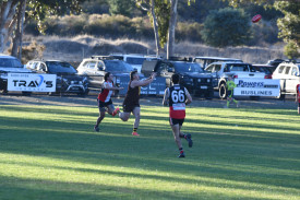 Jarrod Stephens gets the step on Liam Ratliff.