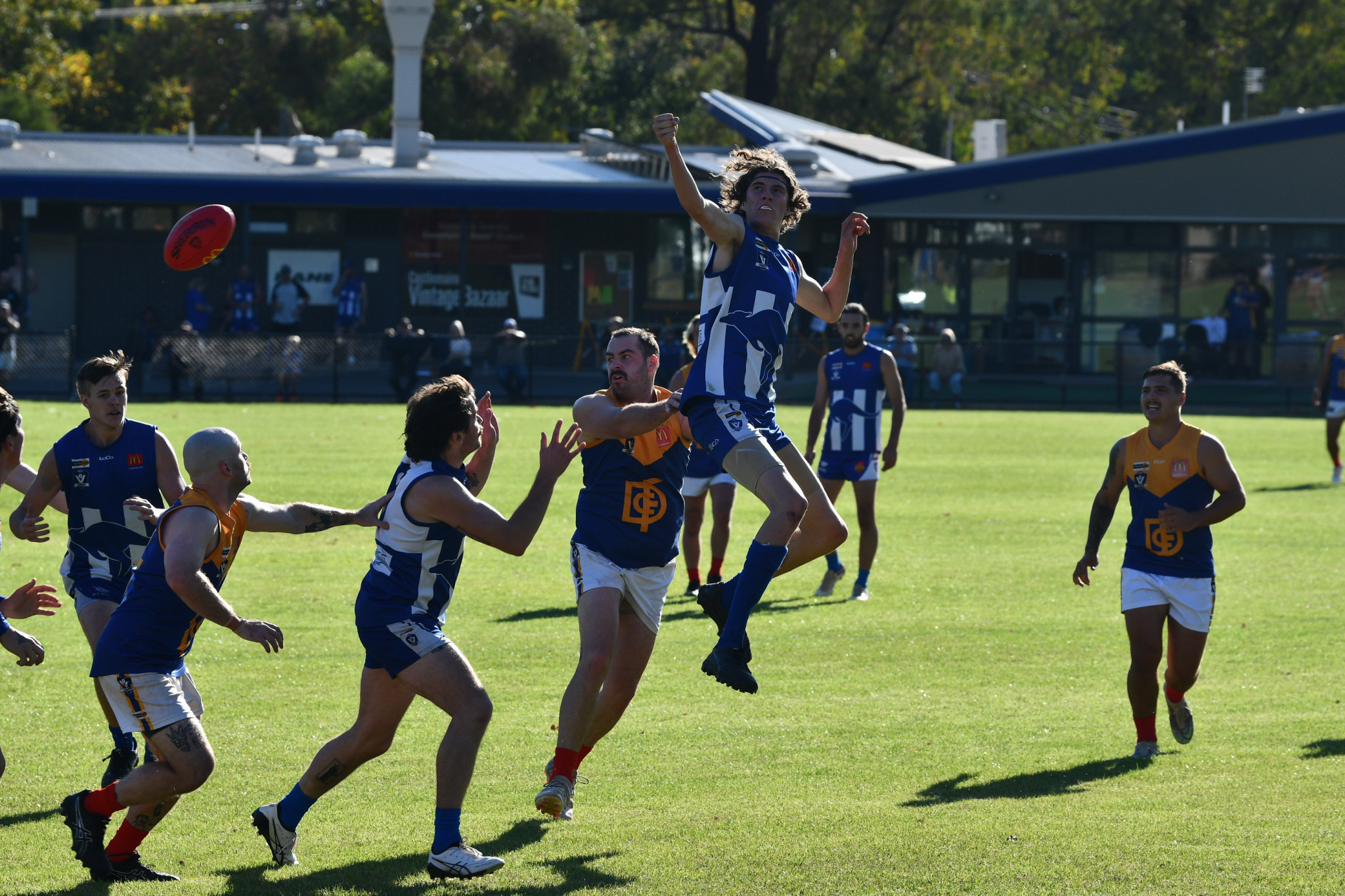 Newstead’s Jovian Goulton gets the punch on fellow ruckman Hayden Parker.