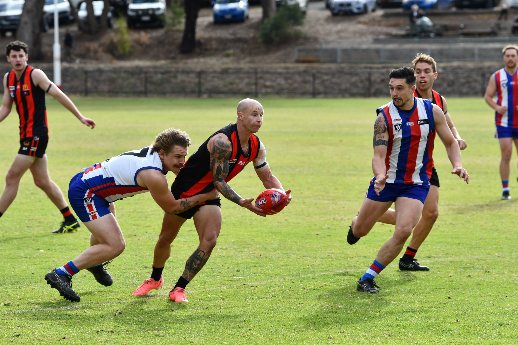 Maldon’s midfield maestro Damian Wust looks to handball out of trouble.